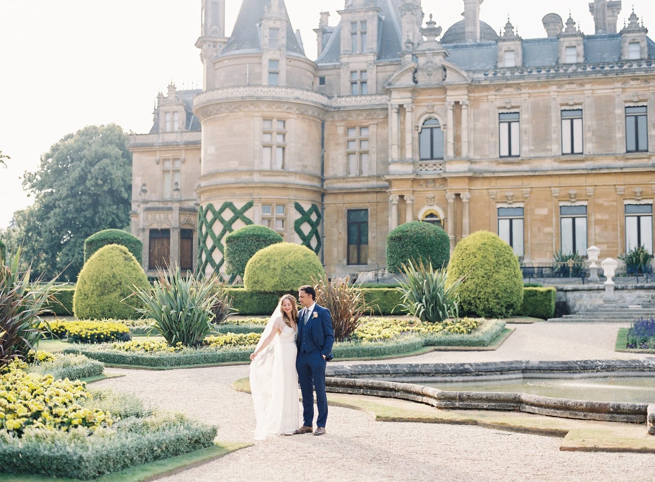 Wedding couple in front of house