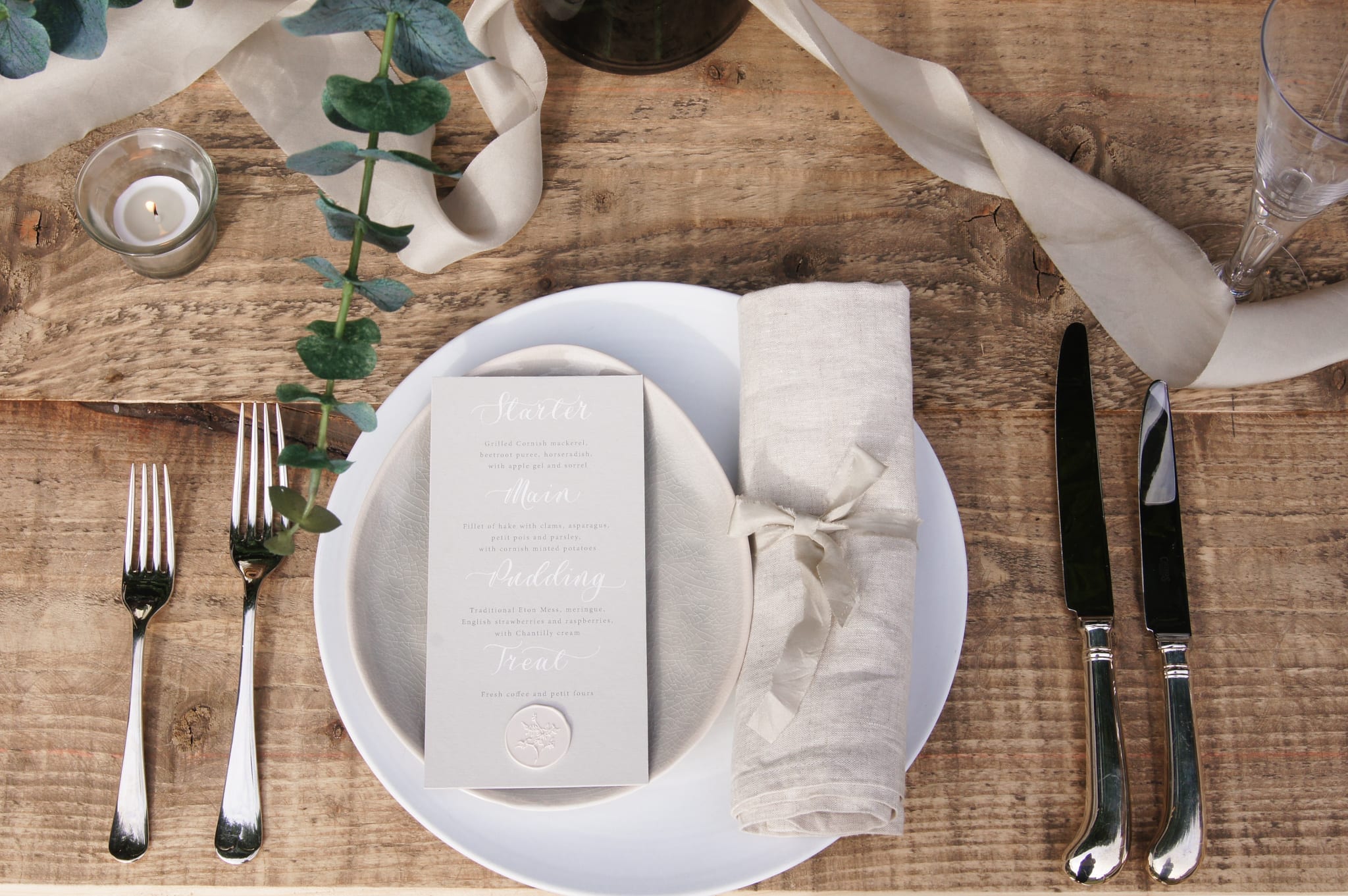 Tablescape with eucalyptus and silk ribbon