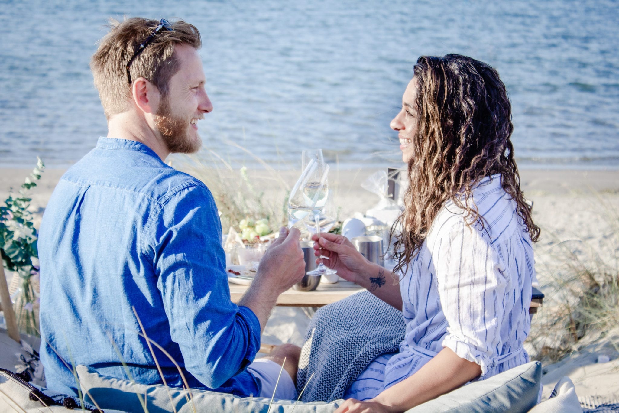 Couple celebrate engagement on beach