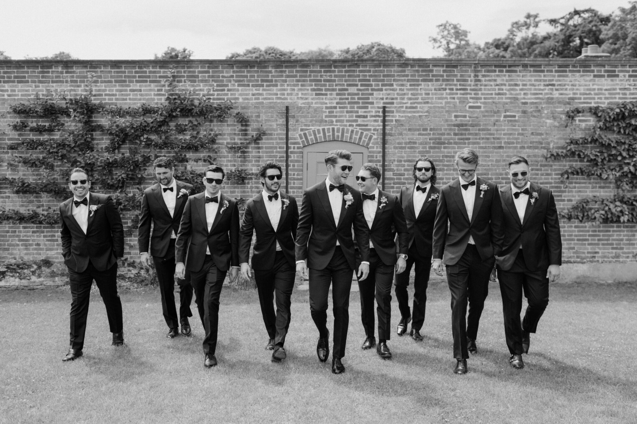 Groom with groomsmen in black tie