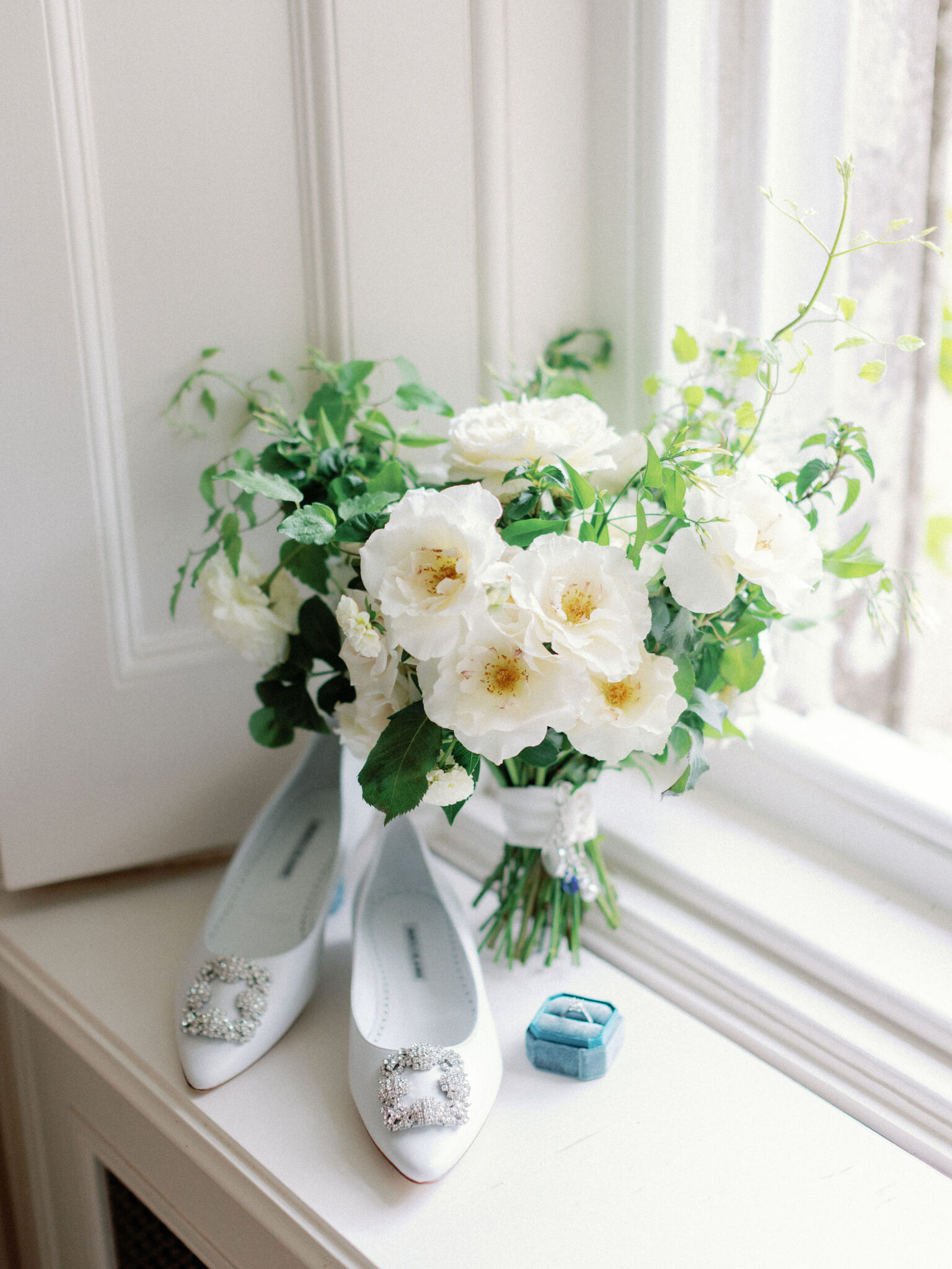 Bridal bouquet with shoes and ring