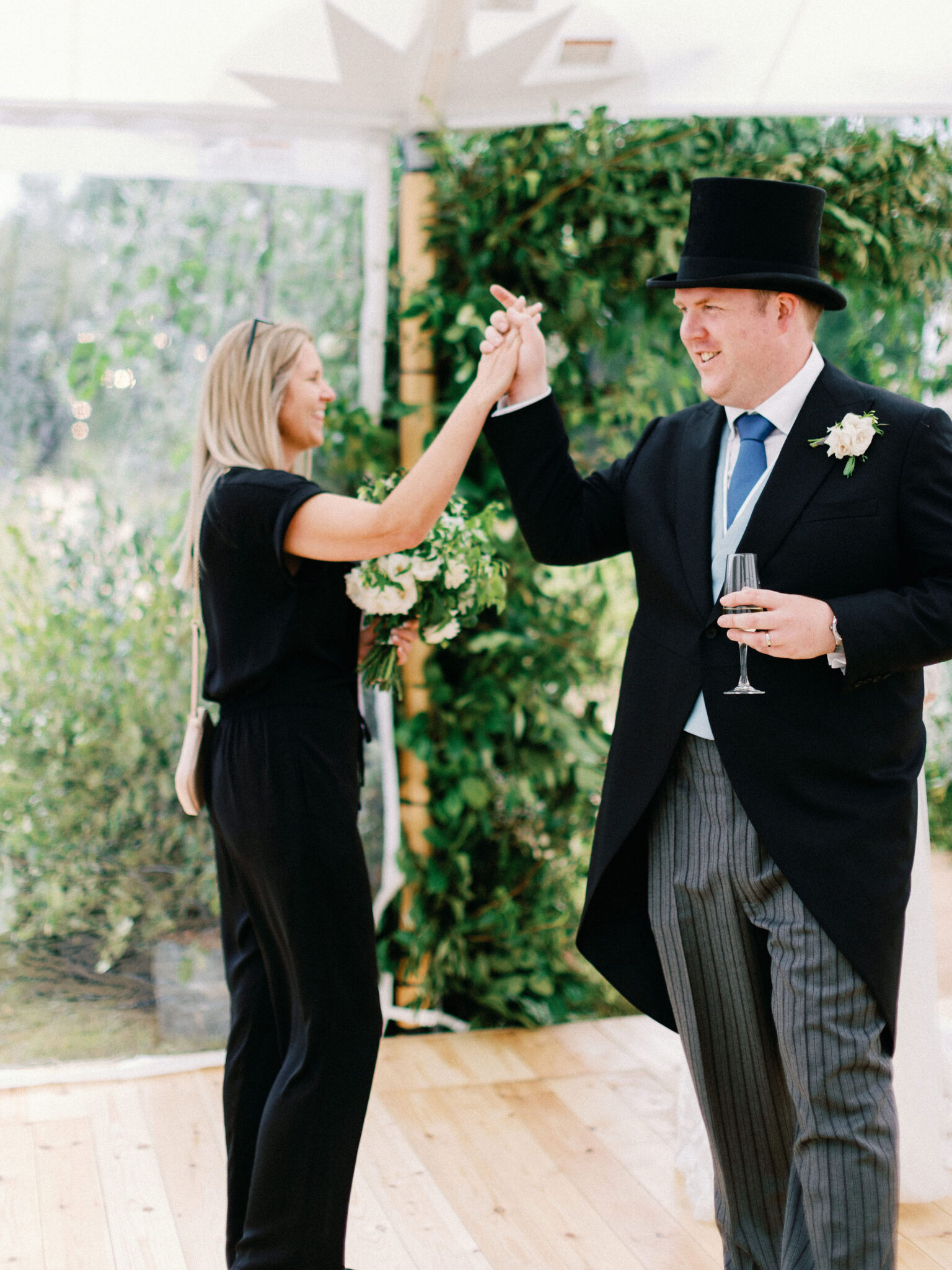 Wedding planner with groom - high five